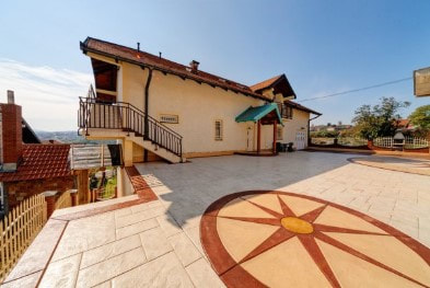 Extensive outdoor living area with stamped patio variation
