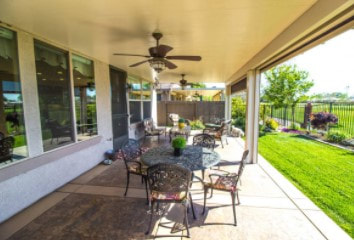 Outdoor covered living area with stamped cement patio