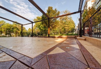 Outdoor living area with stamped cement border