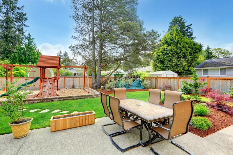 Concrete patio and sidewalk in backyard